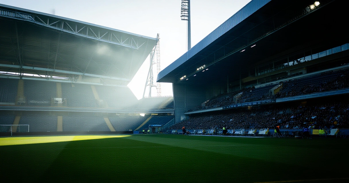Tyhjä jalkapallostadion iltavalossa ennen ottelua
